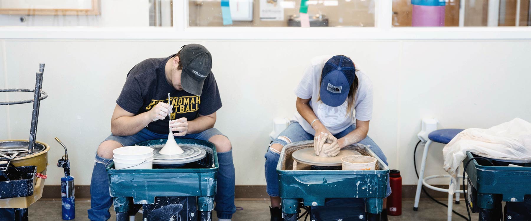 Whitworth students sculpting a clay model