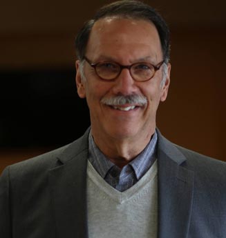Headshot of Arlin Migliazzo