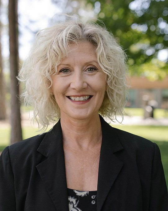Headshot of Bendi Benson Schrambach