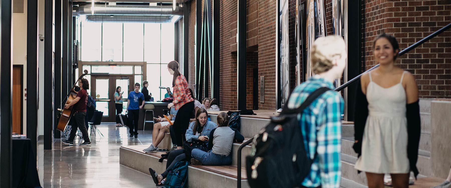 Students gathered along Main Street in the Cowles Music Center.