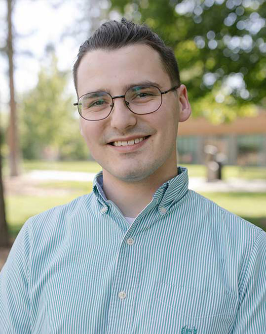 Headshot of Justus Brozek