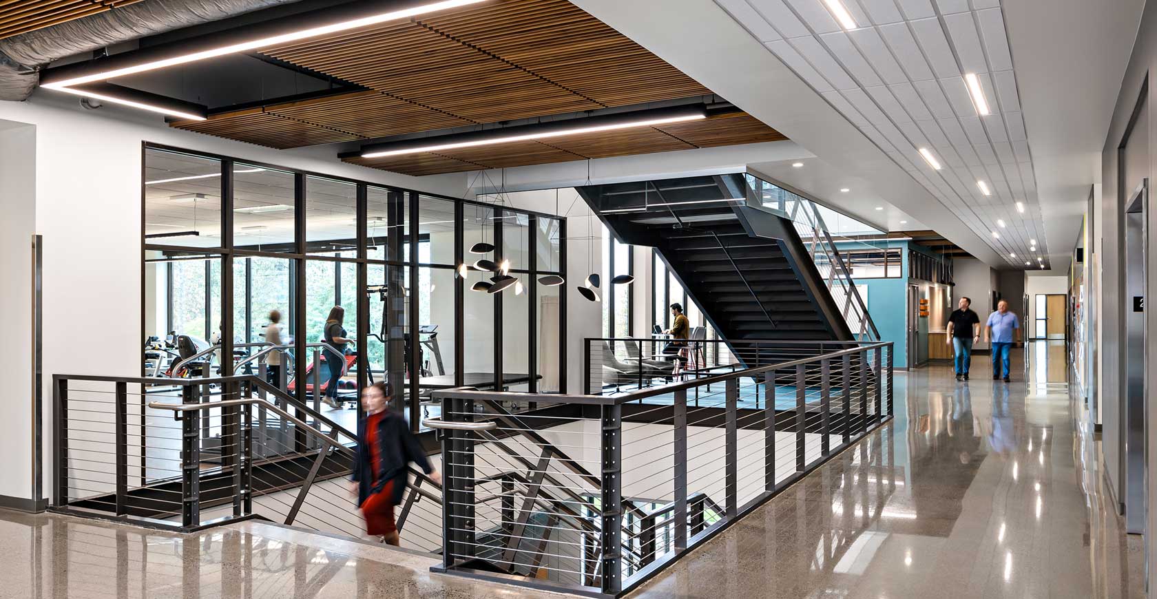 An open stairwell leading up to a hallway inside the Dornsife Health Science Building.