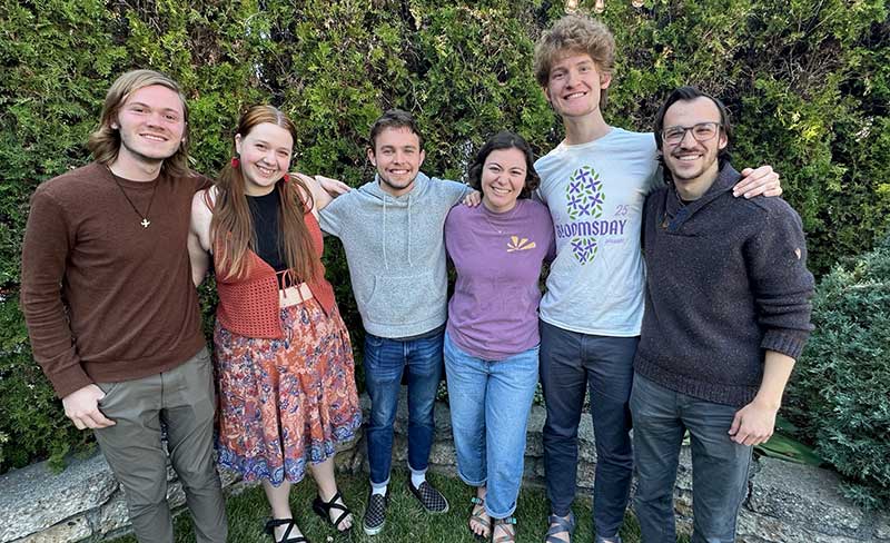 Five students smiling for a photo