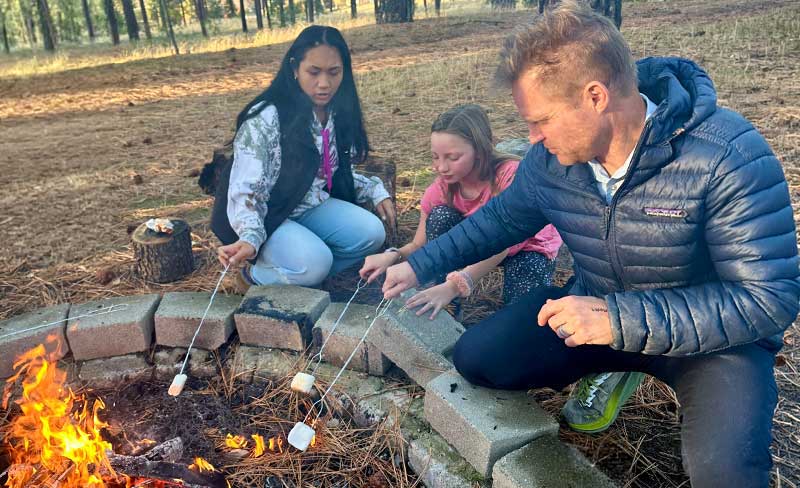 S'mores Event: Jayda Lauti and Josh Leim toast their perfect marshmallows over the fire.