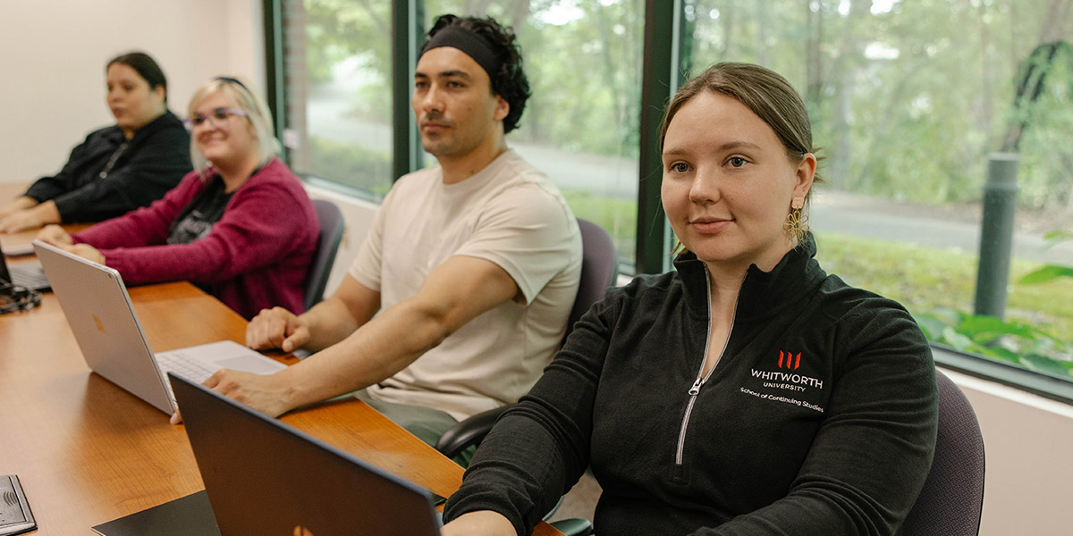Students sitting in a classroom learning