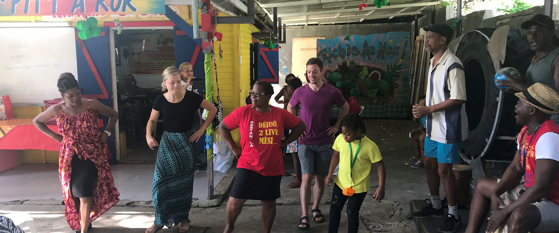 Students and locals dance together