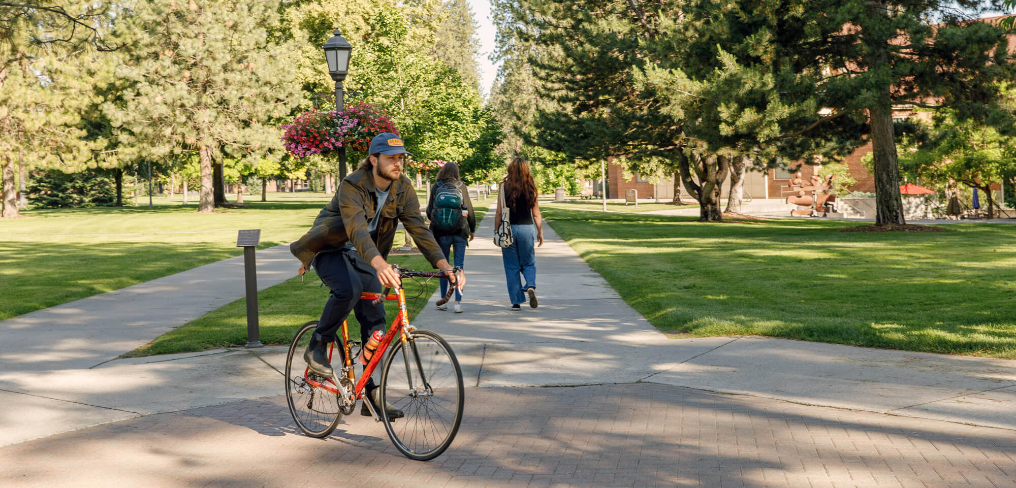 student biking on campus