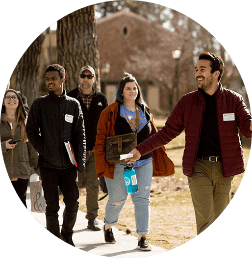 Associate Director of Admissions, Sean Tyson, leads an on-campus tour with a group of students