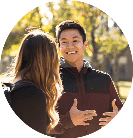 Students talk to each other on campus