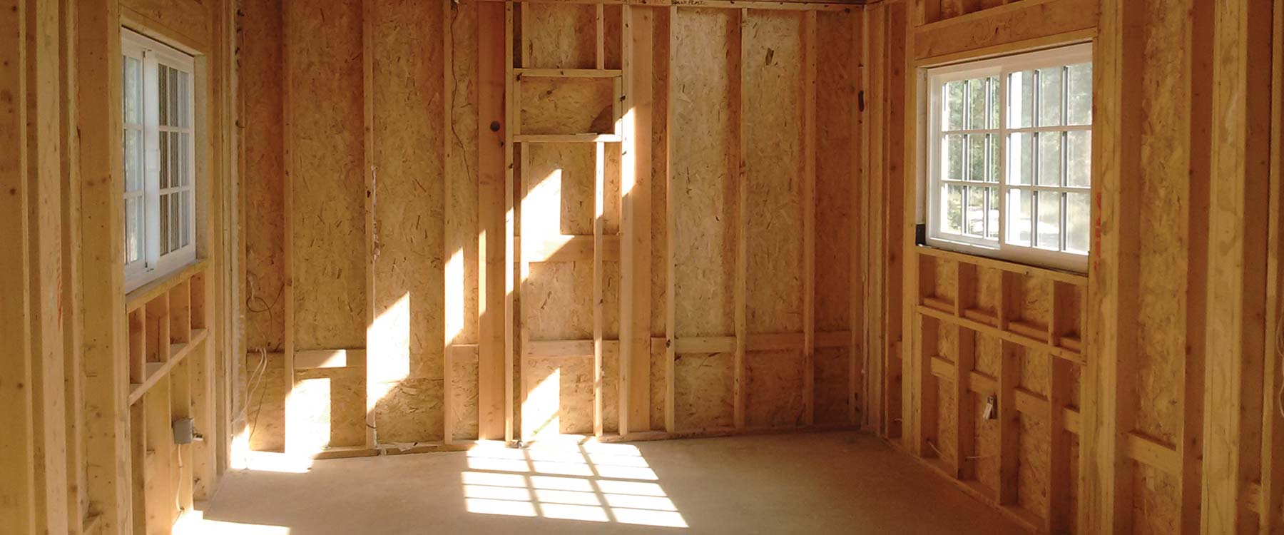 The inside of a house, with wood frame exposed during a house construction project. 