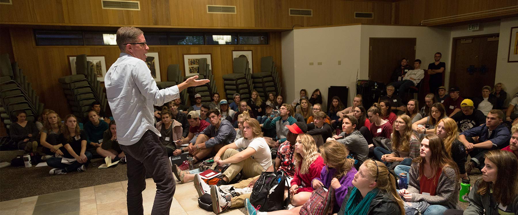 Kent McDonald stands in front of a group of Young Life students.