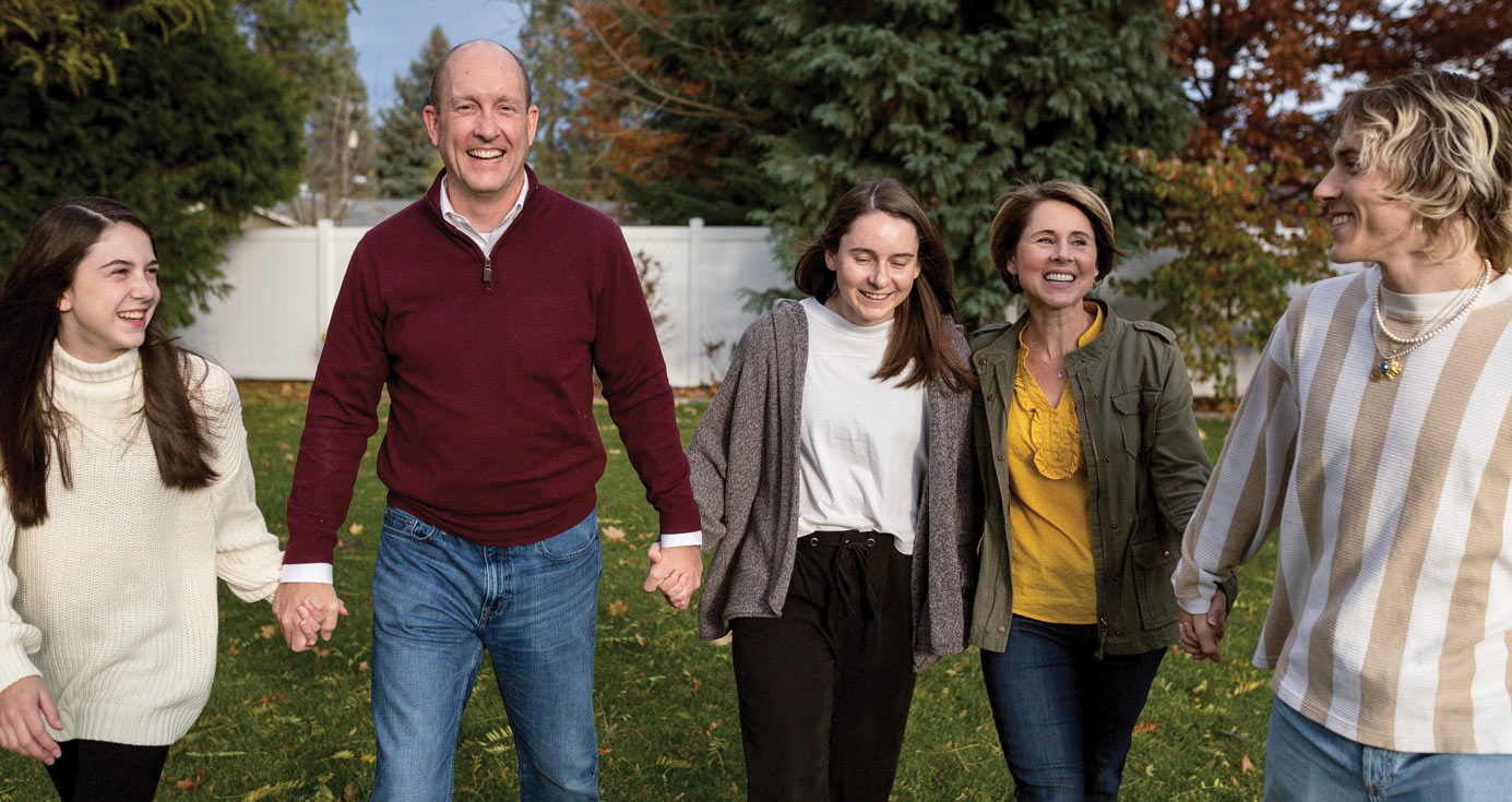 President Beck and Julie Taylor walk hand in hand with family