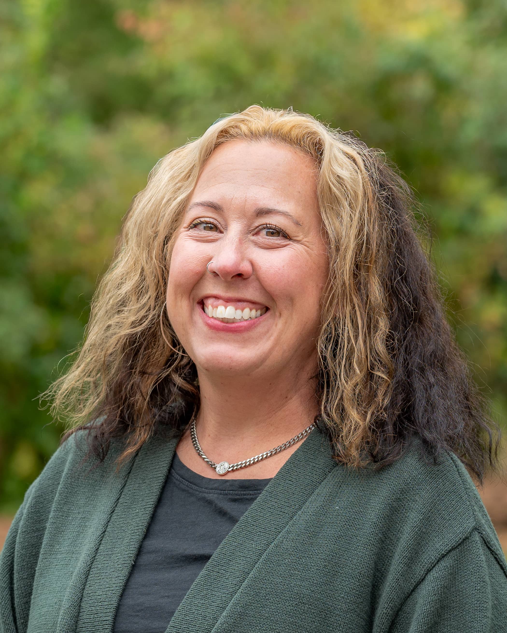 Headshot of Erin Santos-Rollins.